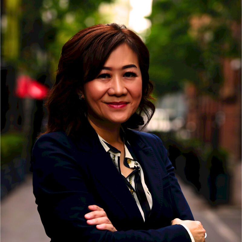 Display of eyeglasses in illuminated hexagon-shaped shelves.
