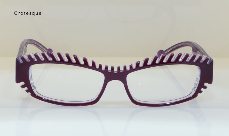 Purple eyeglasses with rectangular frames and spiky detail on the top rim.