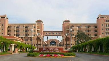 A large building with a sign that says huntington memorial hospital