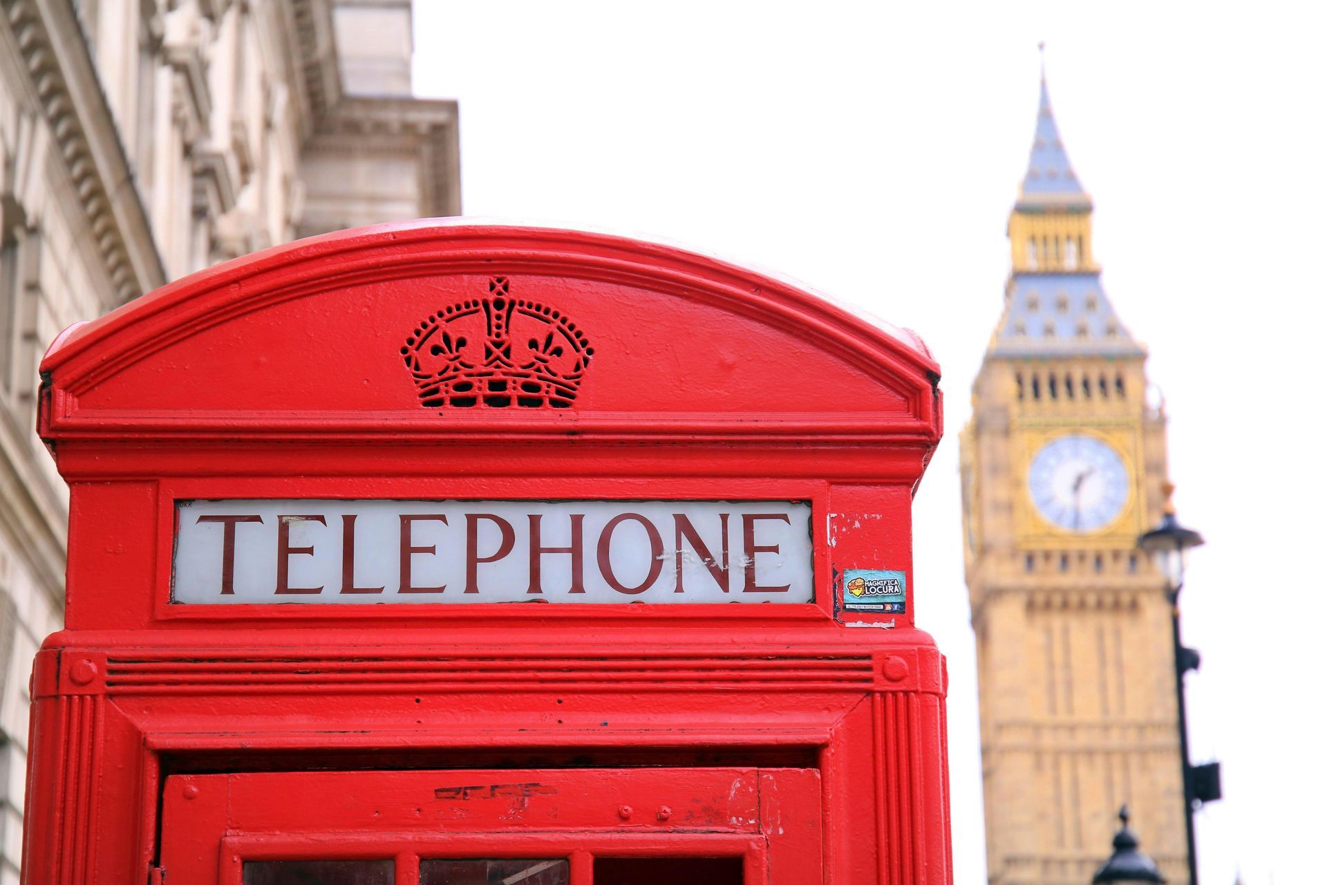 red london telephone booth with the london eye