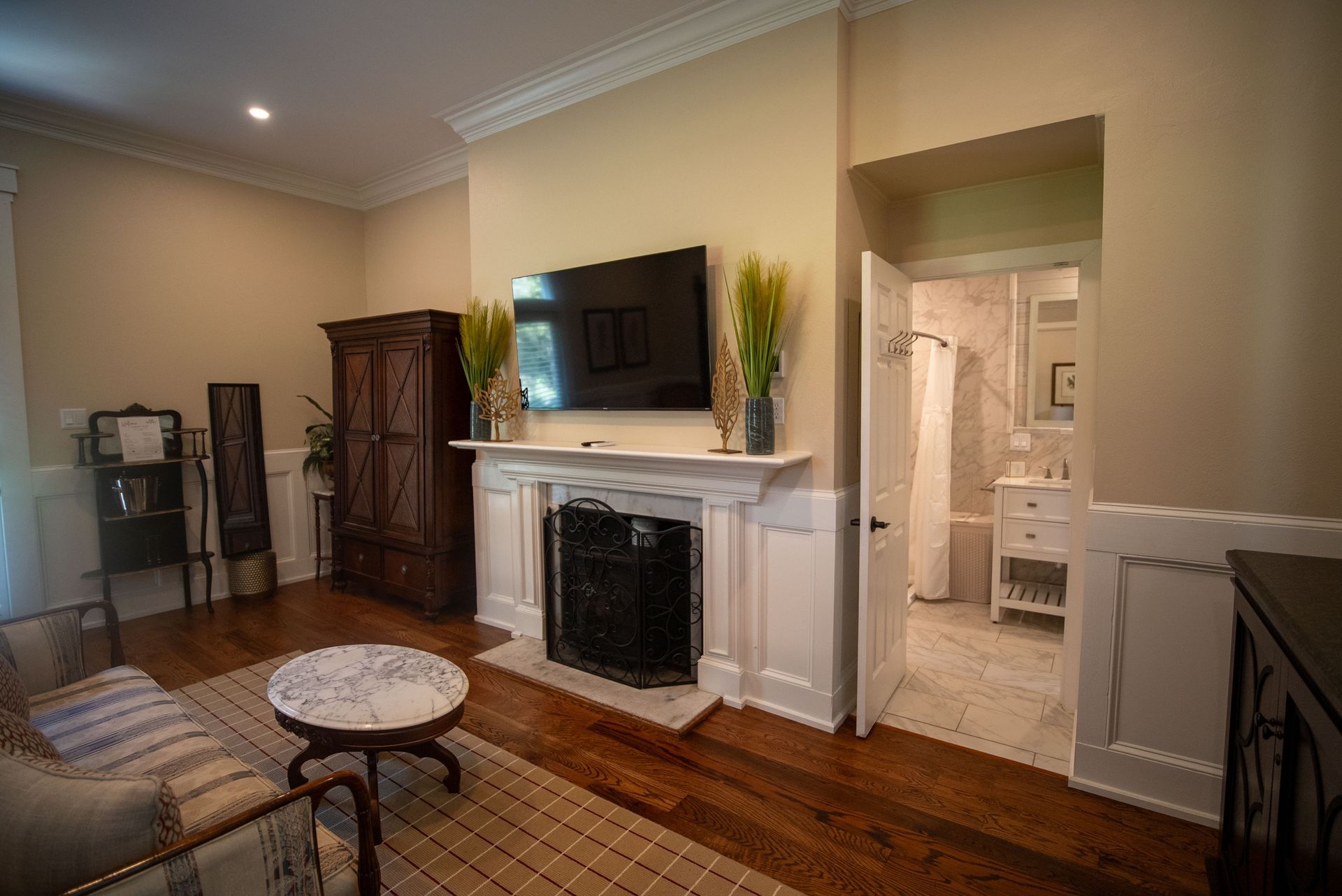 a living room with a fireplace and a flat screen tv .