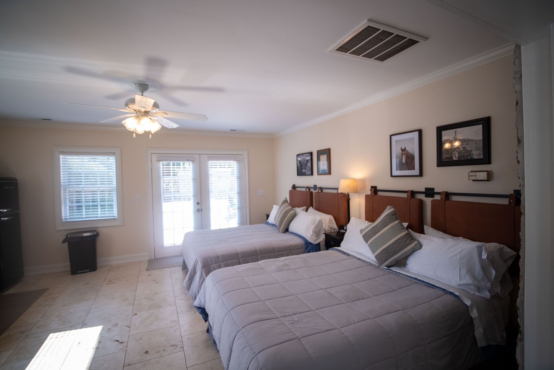 a living room filled with furniture and a ceiling fan .