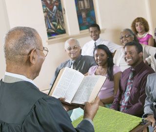 pastor reads scripture to their congregation
