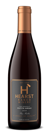 Dark wine bottle with copper cap and label reading “HEARST”