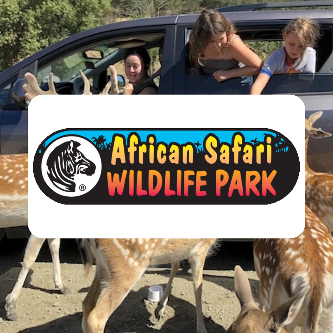 A sign for african safari wildlife park with a picture of deer