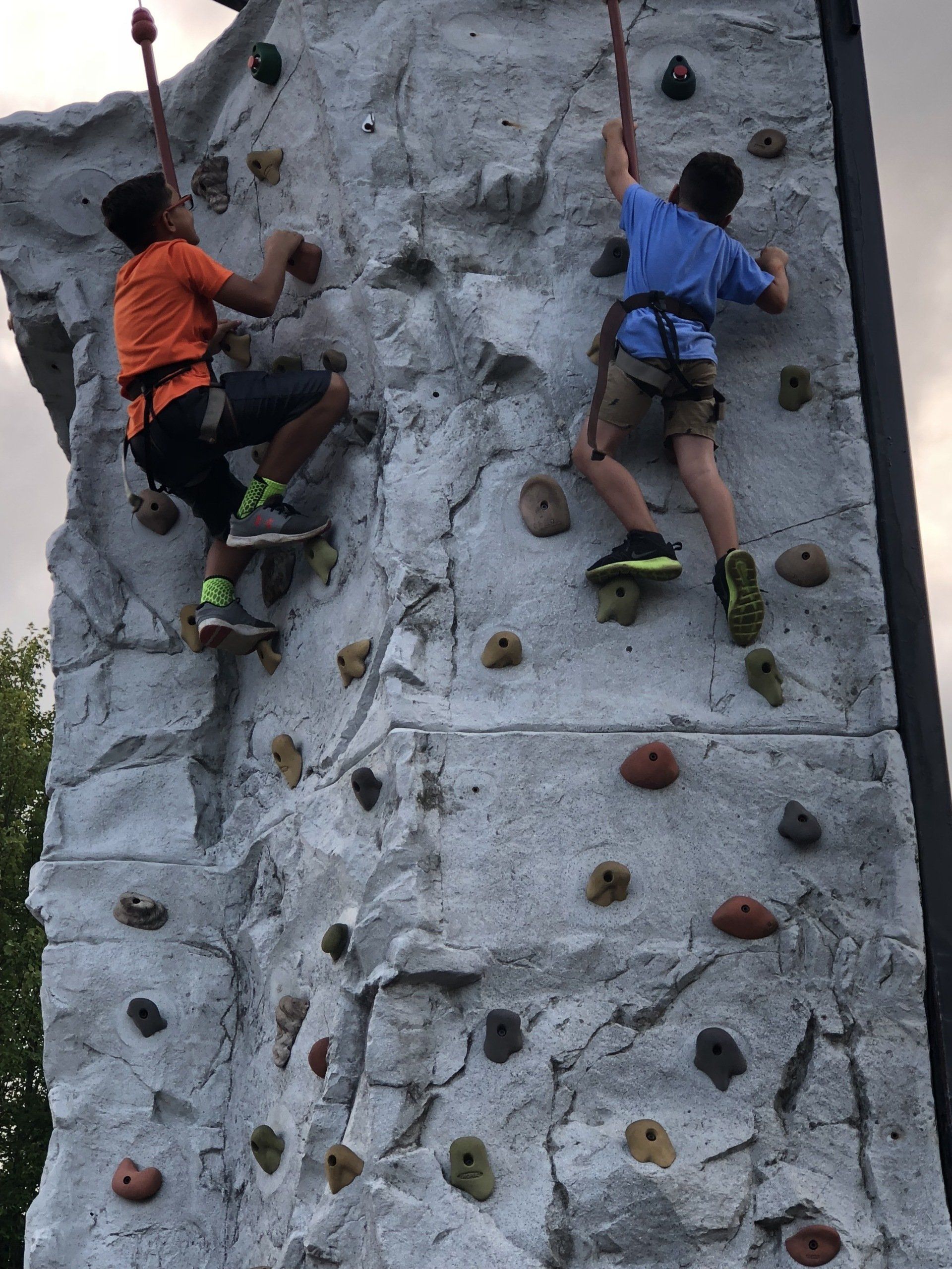 Boys Enjoying on The Top of The Rock Wall — Chicopee, MA — Cliffhangers Portable Rock Climbing Wall