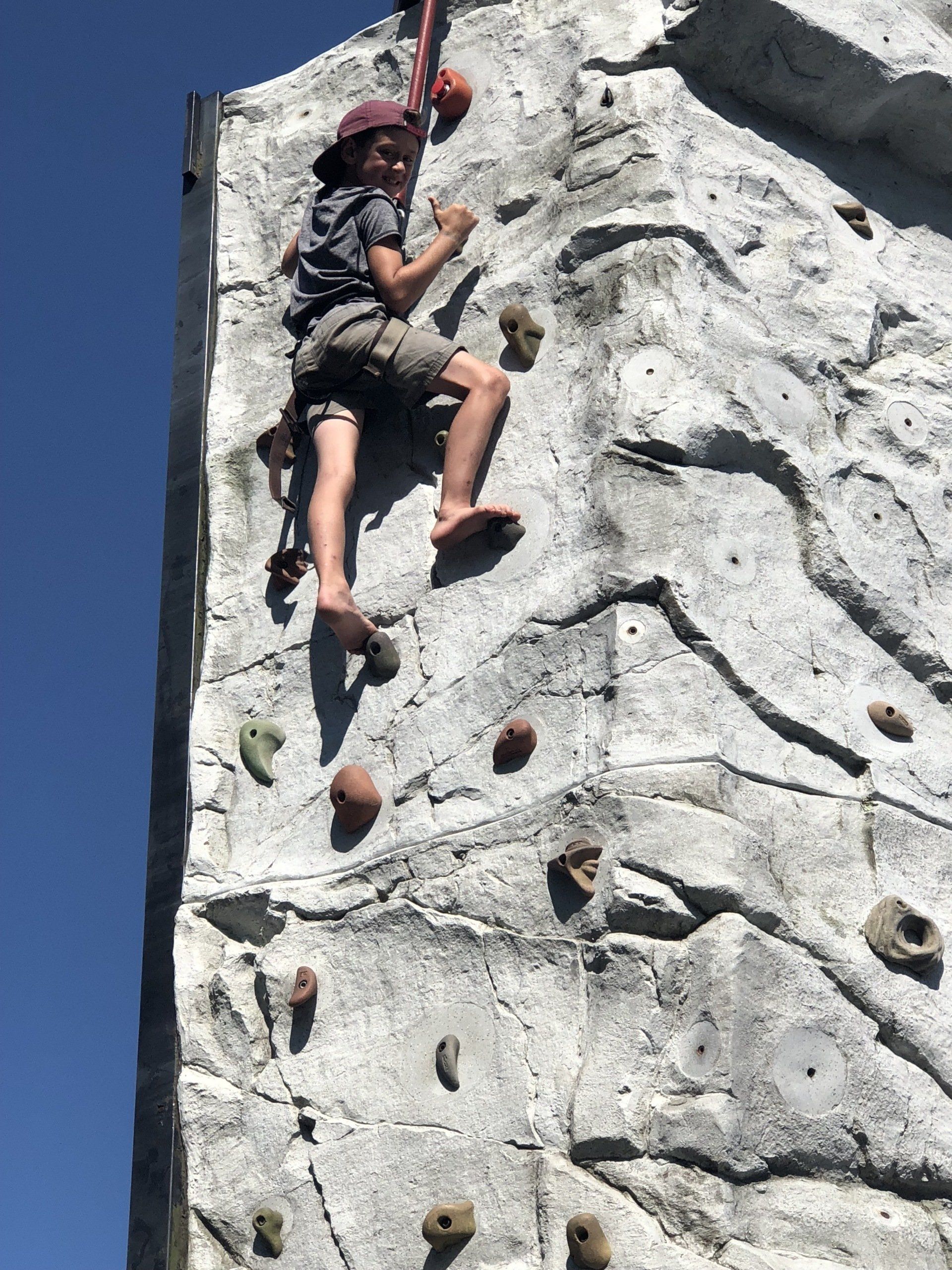 Boy Smiling and Thumbs up — Chicopee, MA — Cliffhangers Portable Rock Climbing Wall