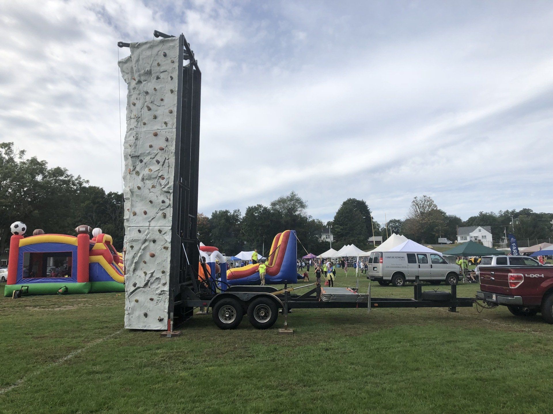 Portable Rock Wall Climbing Placing on The Field — Chicopee, MA — Cliffhangers Portable Rock Climbing Wall