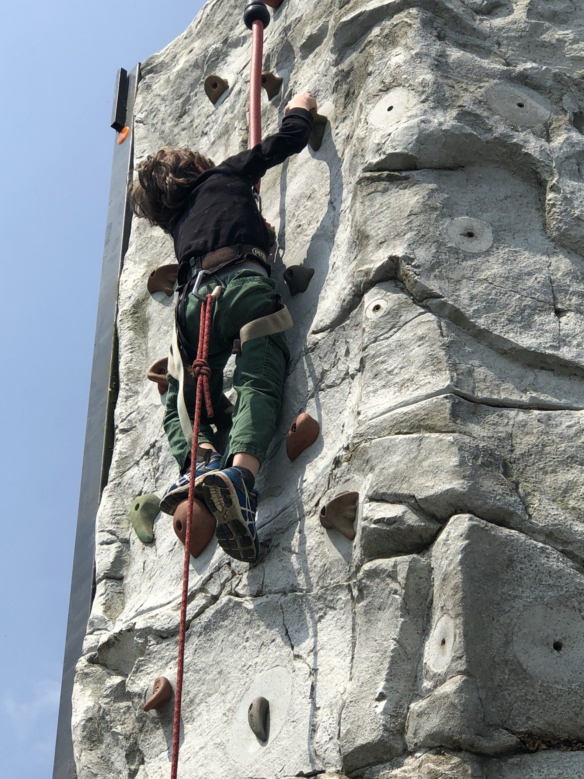 Boy Reaching the Top of The Wall — Chicopee, MA — Cliffhangers Portable Rock Climbing Wall
