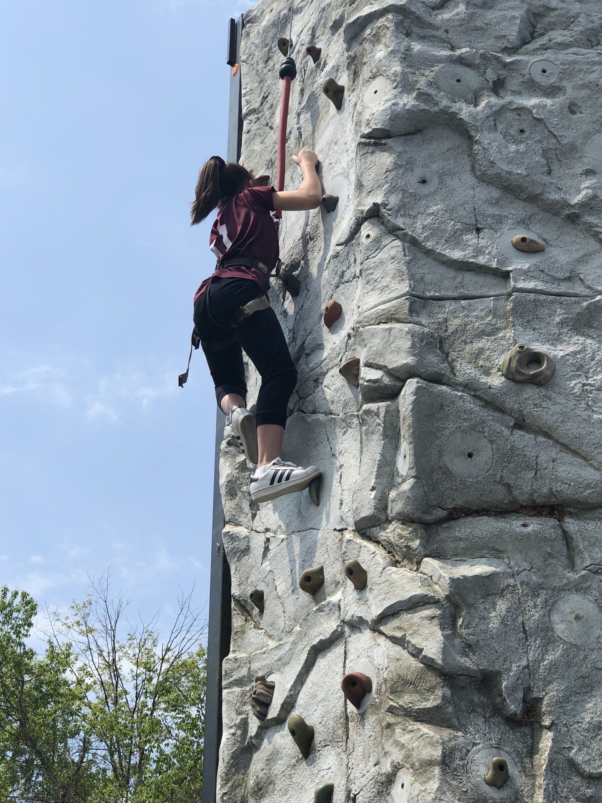 Woman Climb on the Portable Wall Rock — Chicopee, MA — Cliffhangers Portable Rock Climbing Wall