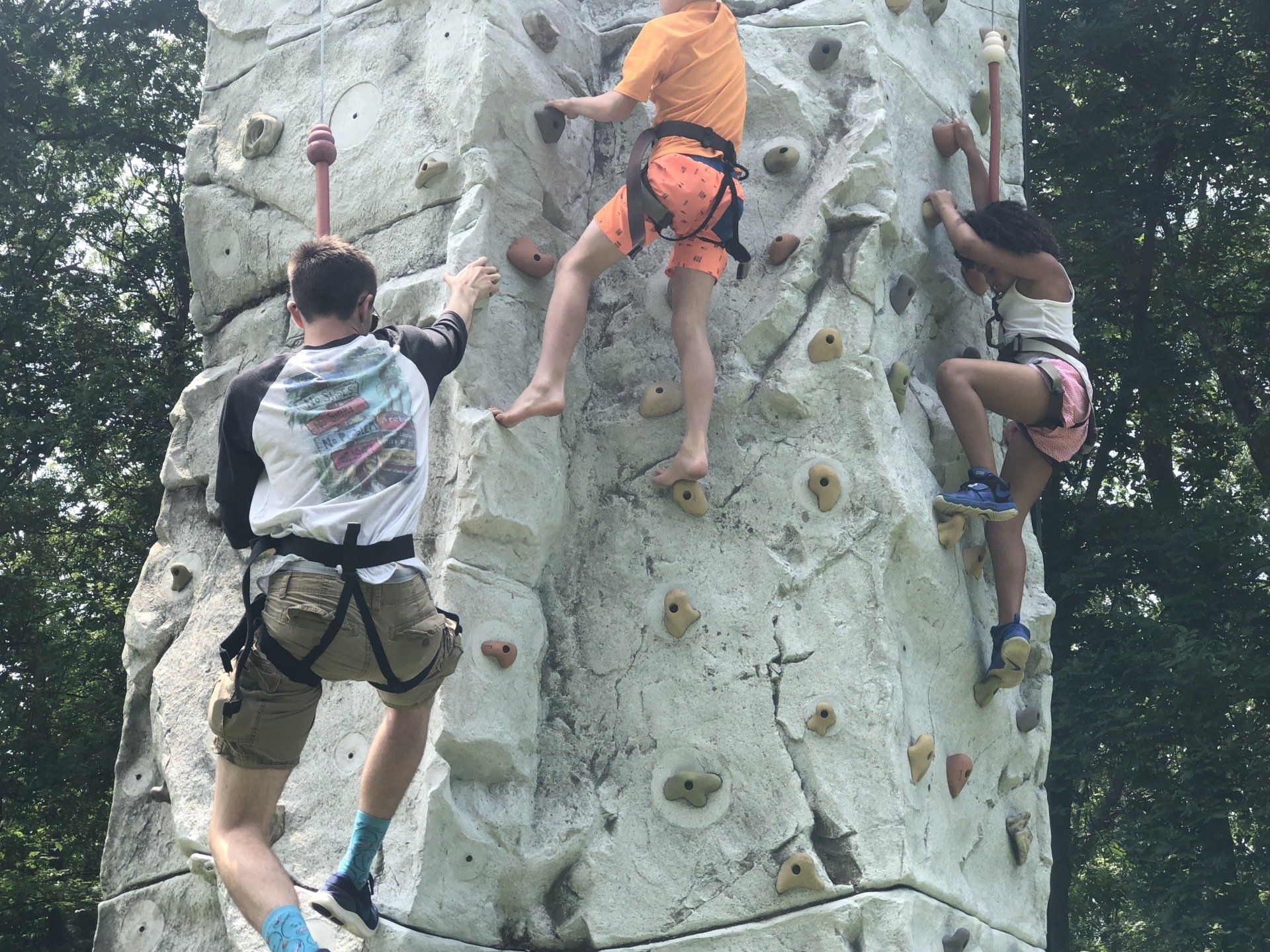 Adult Assisting the Children While Climbing — Chicopee, MA — Cliffhangers Portable Rock Climbing Wall