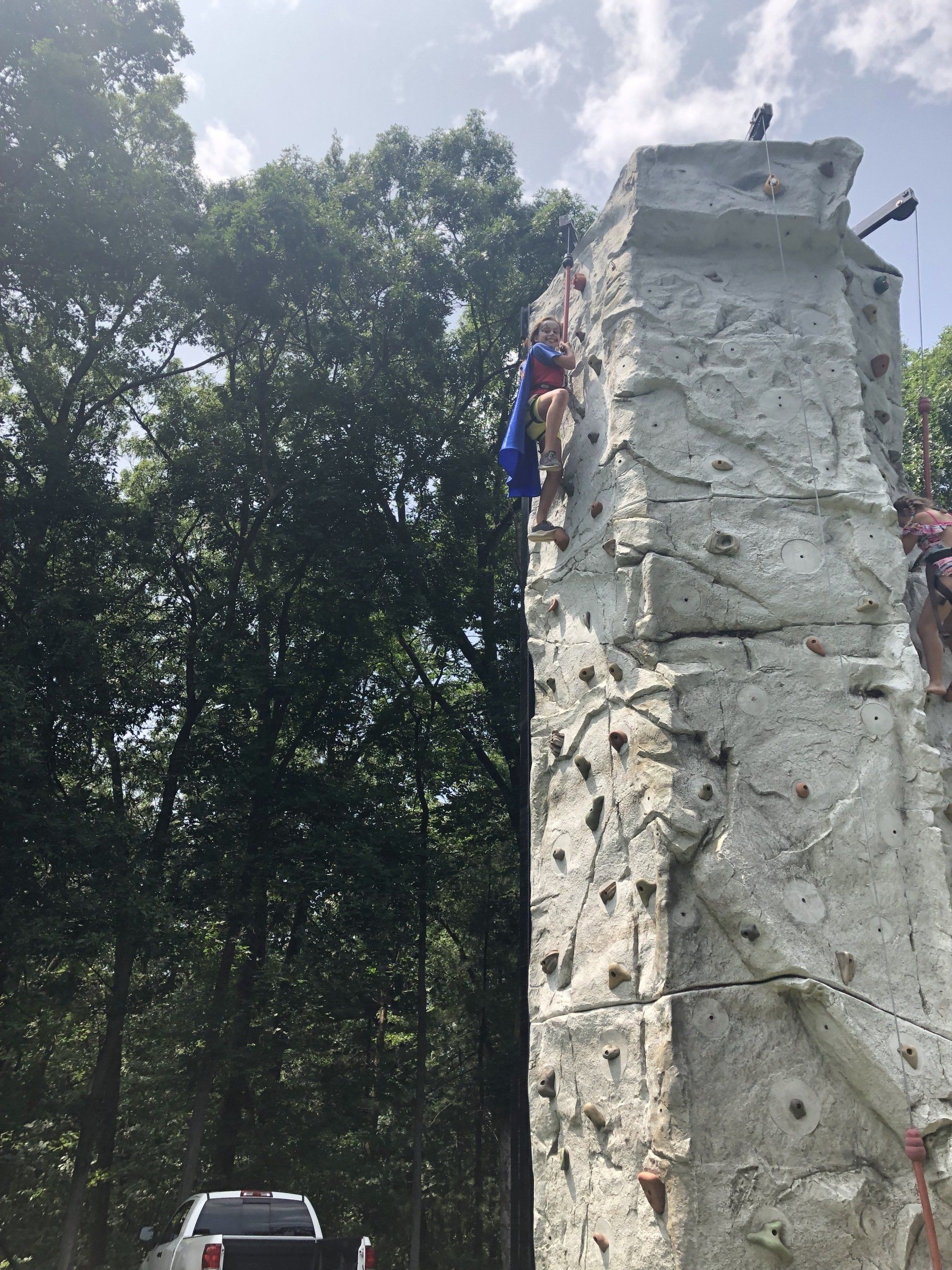 Girl Strongly Hold Stones While Climbing — Chicopee, MA — Cliffhangers Portable Rock Climbing Wall