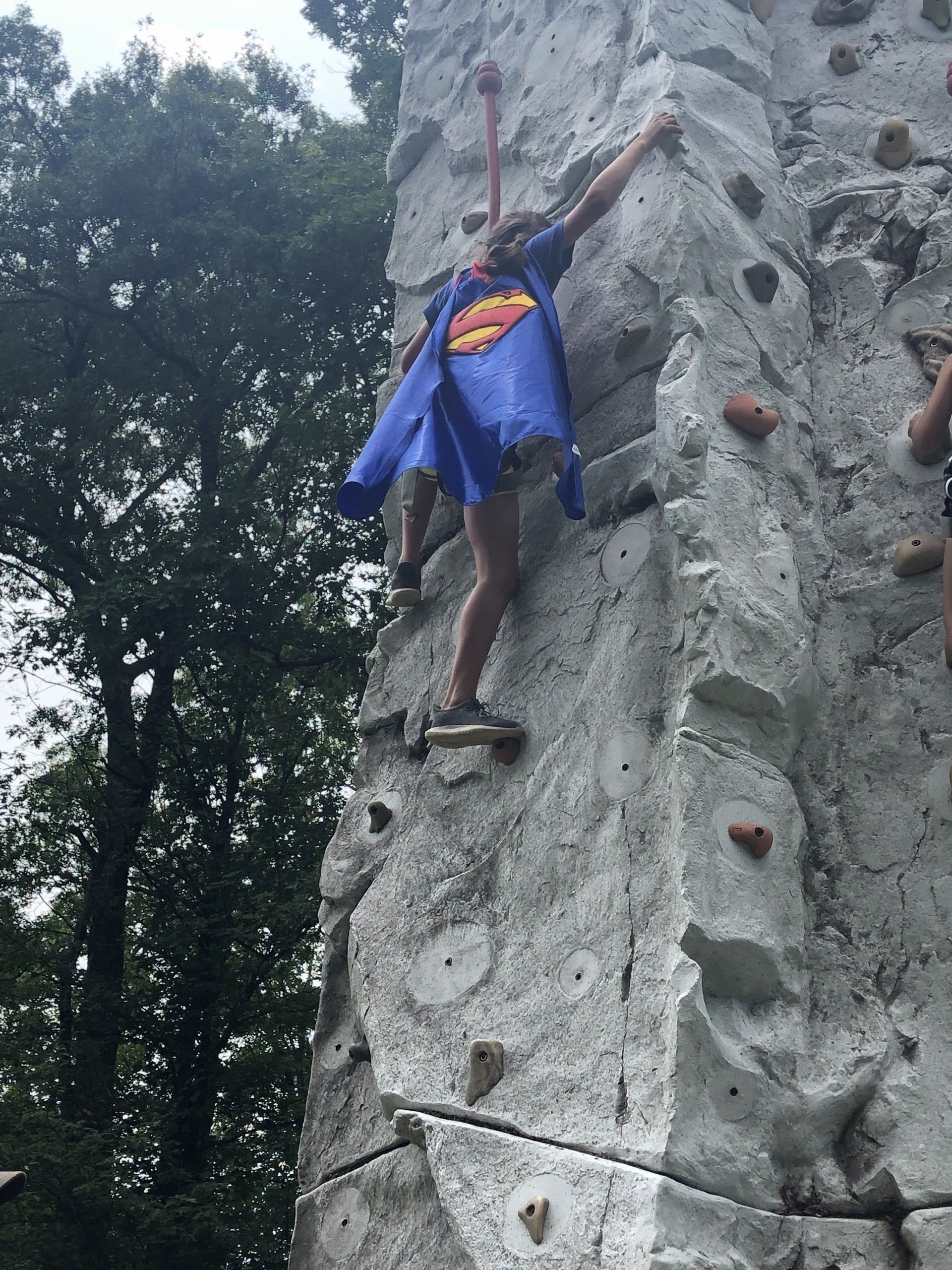 Girl Wearing Cape While Climbing — Chicopee, MA — Cliffhangers Portable Rock Climbing Wall