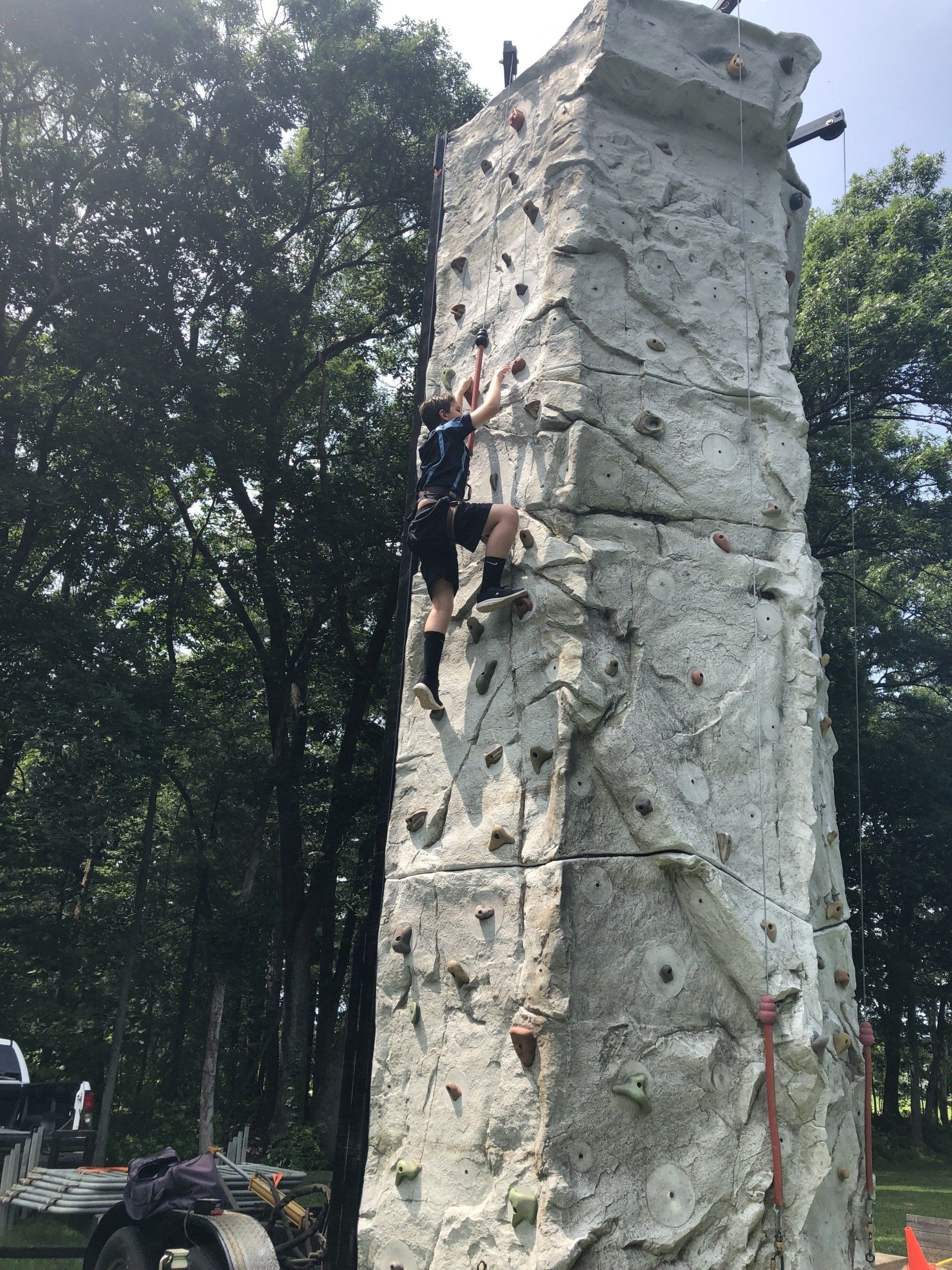 Girl Climbing on The Climbing Wall — Chicopee, MA — Cliffhangers Portable Rock Climbing Wall