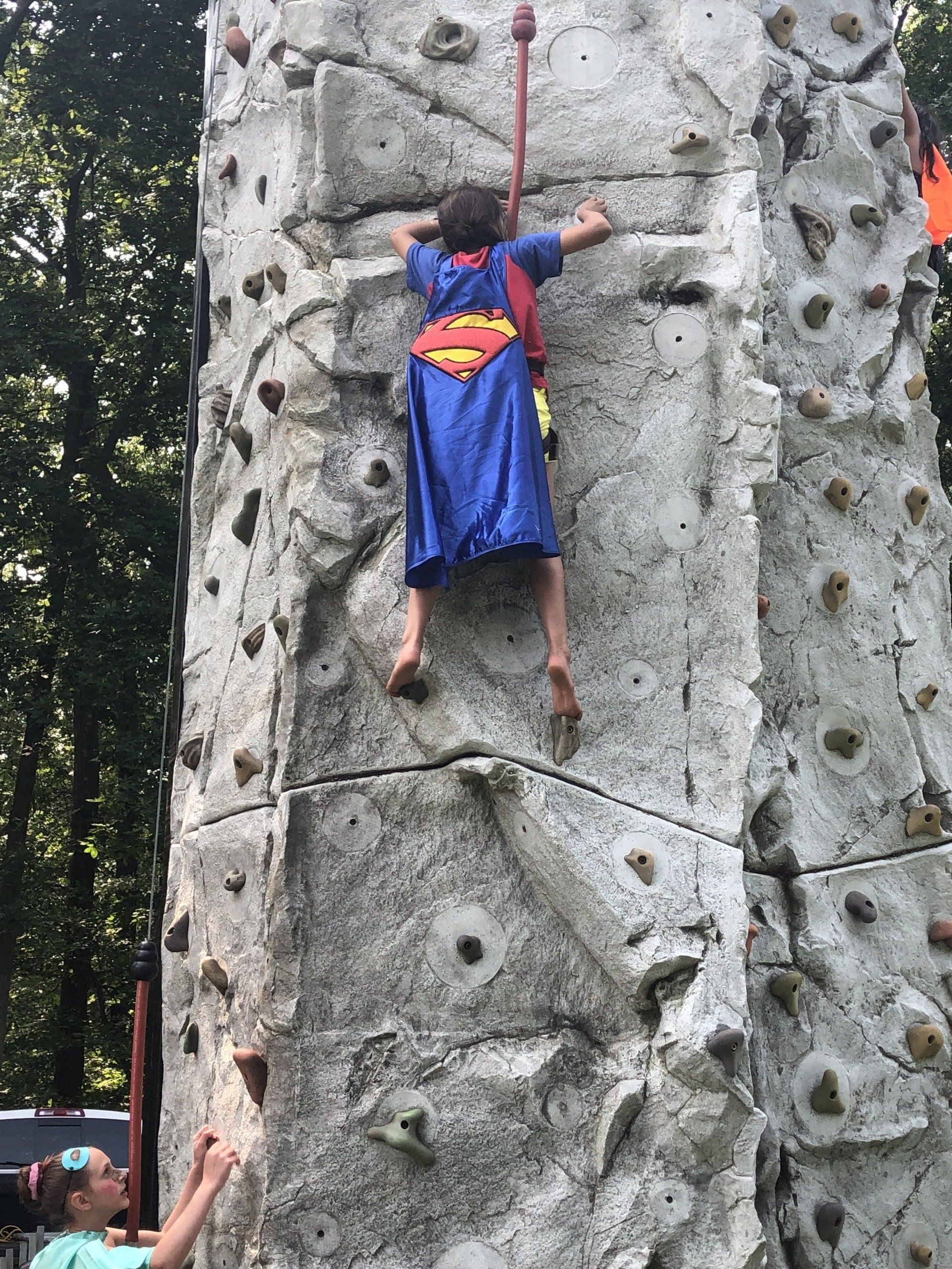 Girl with Character Climbing on The Rock Wall — Chicopee, MA — Cliffhangers Portable Rock Climbing Wall