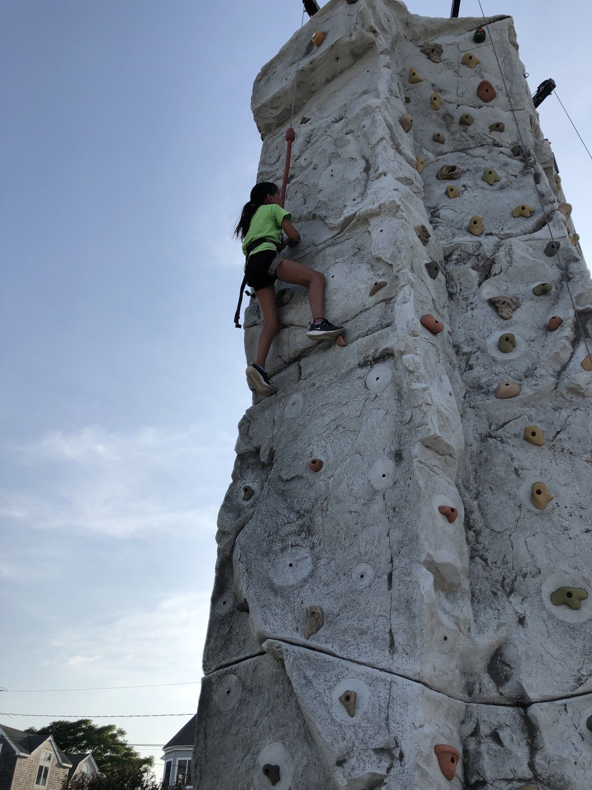 Girl Reaching the Top Rock Climbing Wall — Chicopee, MA — Cliffhangers Portable Rock Climbing Wall