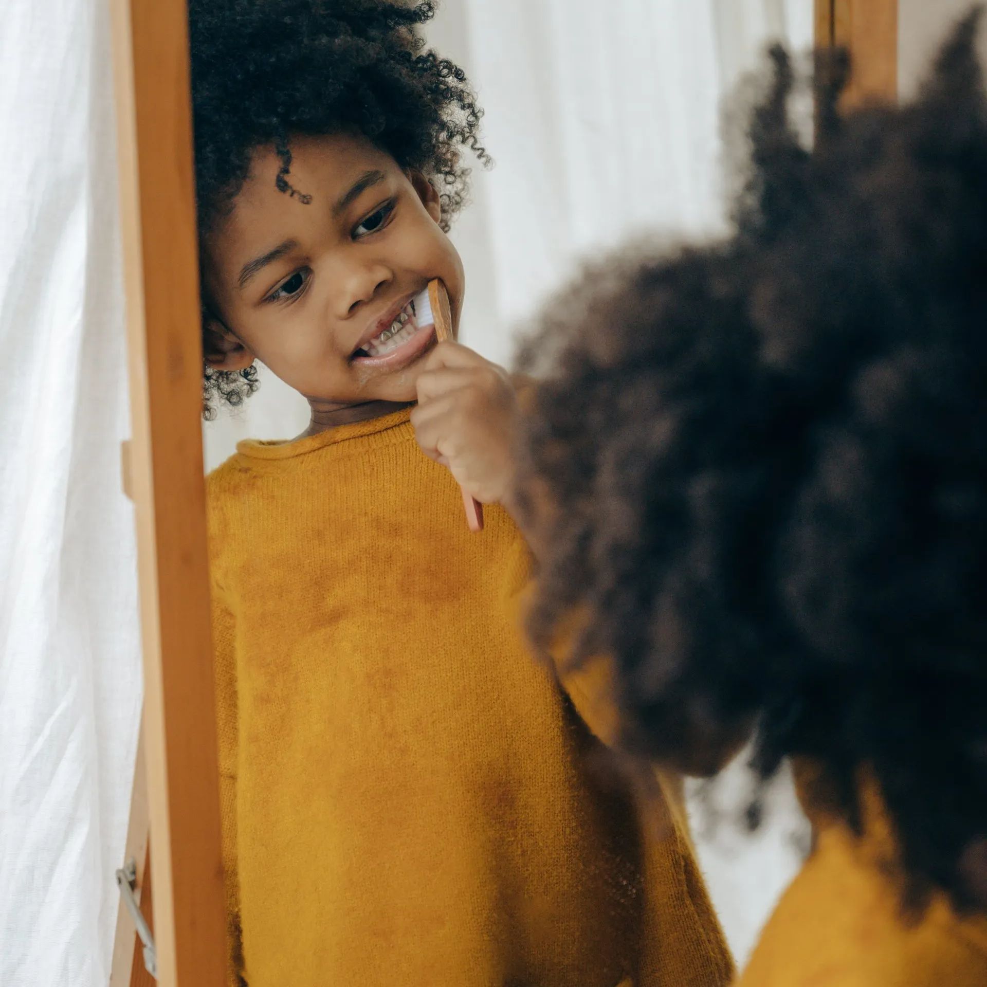 child brushing teeth