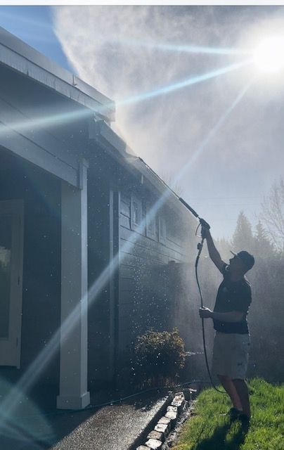 Worker doing pressure washing