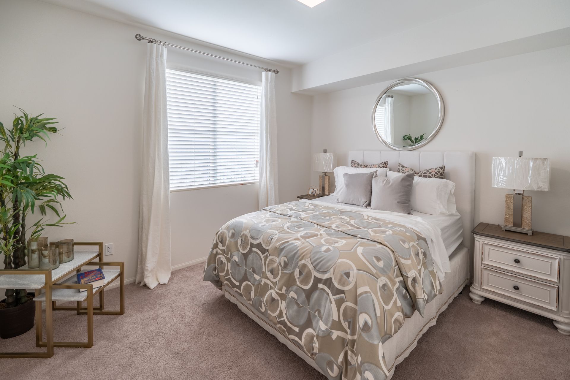 A bedroom with a bed and window