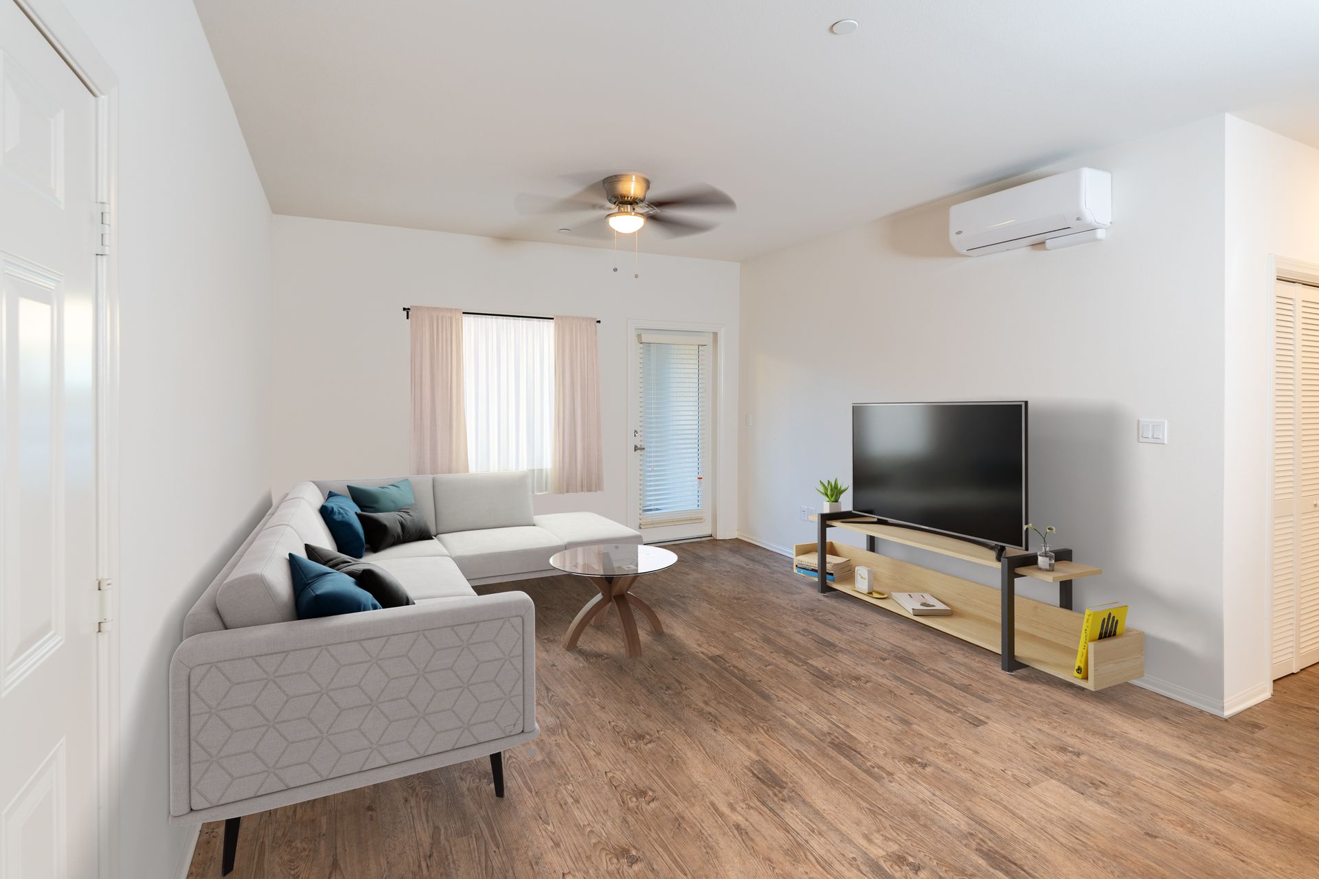 A living room with couch and television