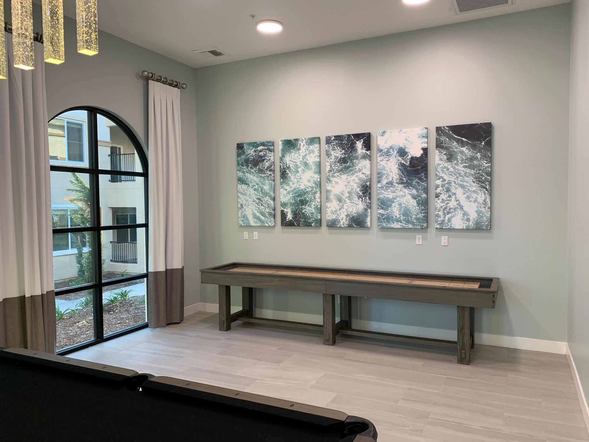 Shuffleboard table in the corner of a community room