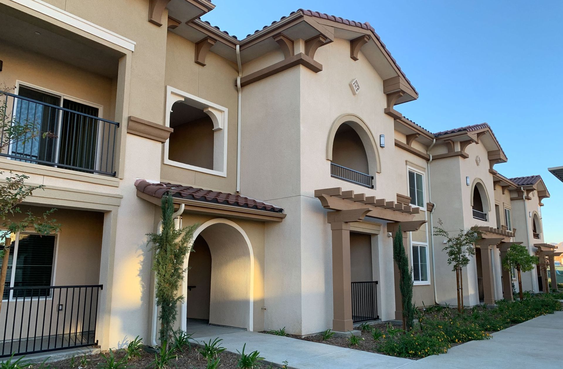 a row of apartment buildings are lined up in a row