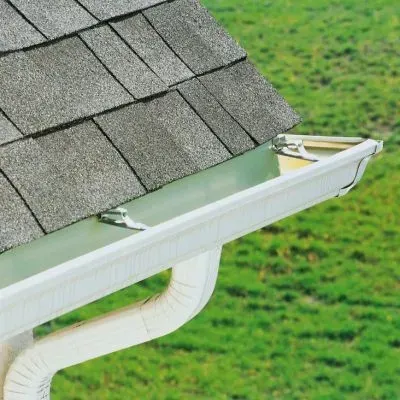 A clean one-storey gutter and downpipe showing consistent maintenance and reliable roof drainage in Dunedin.