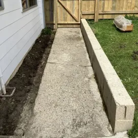After: completed water blasting job for a  concrete path and retaining wall for a residential customer in Bradford.