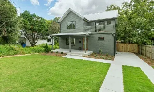 Council-compliant section clearing results in a tidy lawn and clear boundary lines in Dunedin.