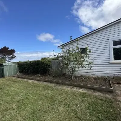 After: Garden maintenance, tidying of area beside a clients residential home in St Clair.