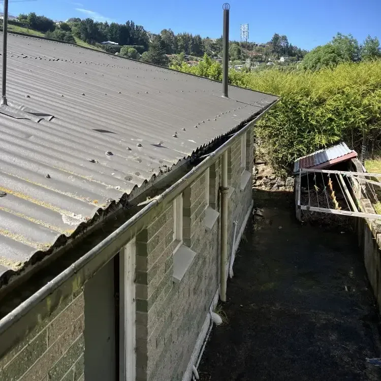 After: Clean roof gutter cleared of grass and debris after gutter cleaning, Mornington, Dunedin.