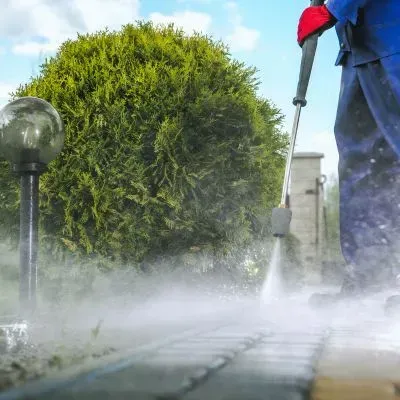Professional pressure washing using controlled cleaning techniques to protect surrounding surfaces.