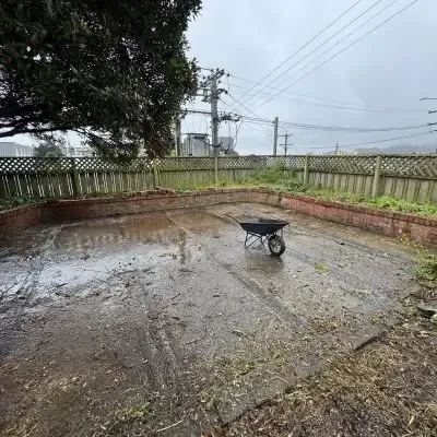 After: Garden maintenance services for the removal of weeds and vegetation on a concrete backyard/patio. St Clair.