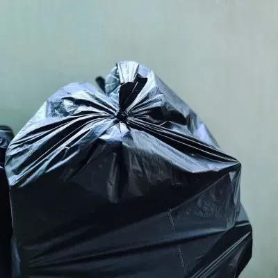 Sealed rubbish bag in Dunedin showing safe handling and secure containment during waste removal.