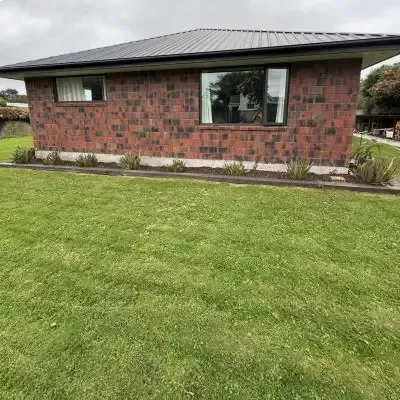 After: Removal of flax bushes and garden bed tidy up.