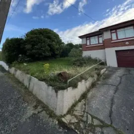 Before: Front section clean up, removal of overgrown vegetation for a flat in St Clair, Dunedin.
