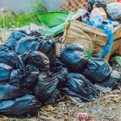Mixed waste in Dunedin is separated into piles showing correct sorting for disposal and recycling.