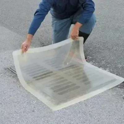 Stormwater drain is being covered for protection before water blasting to comply with Dunedin runoff regulations.