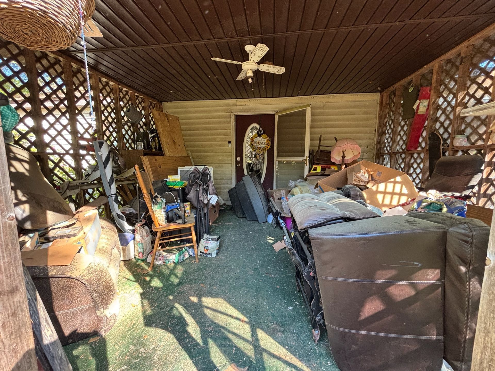 Before — cluttered space prior to junk removal