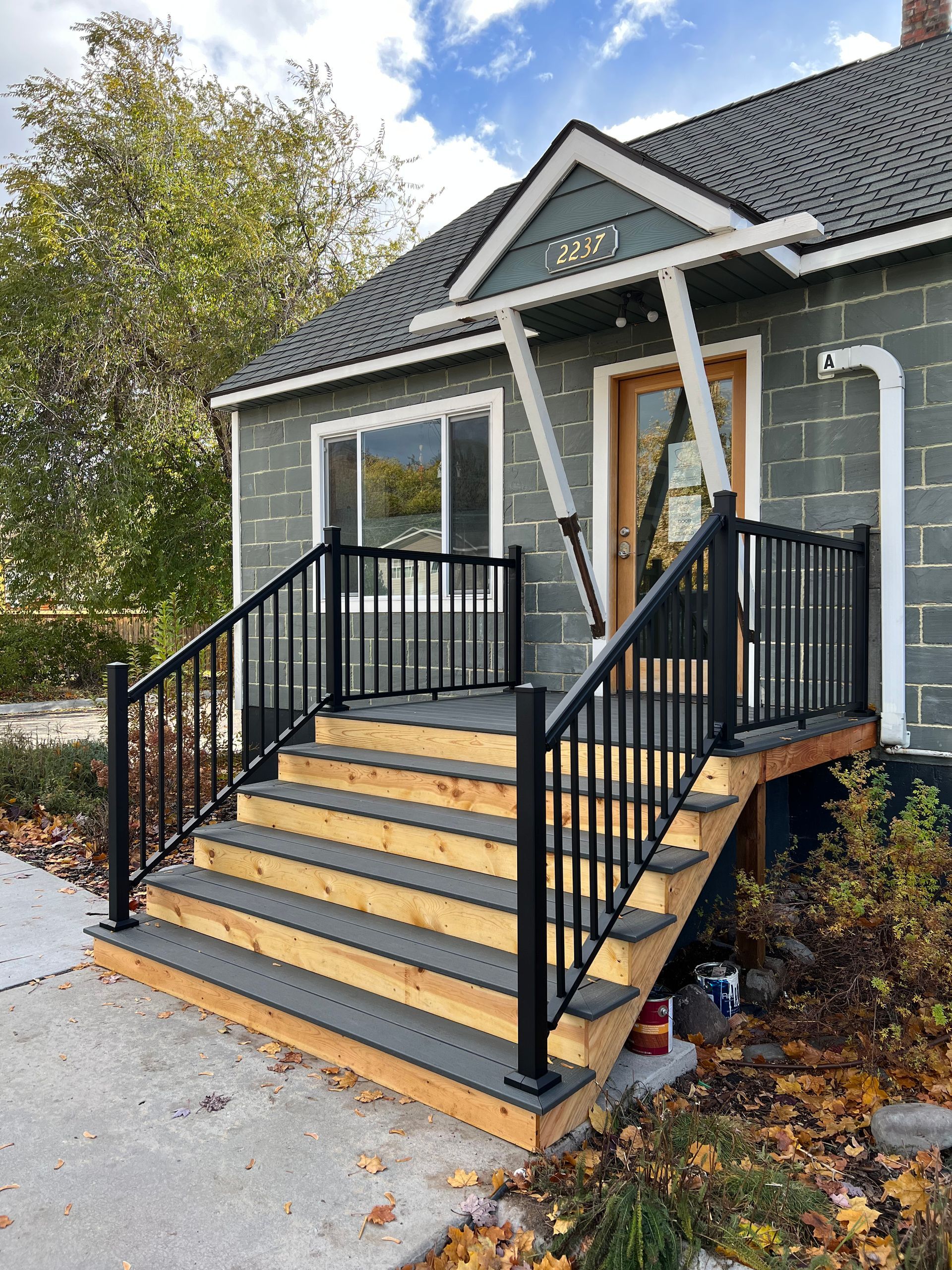 A house with stairs leading up to the front door