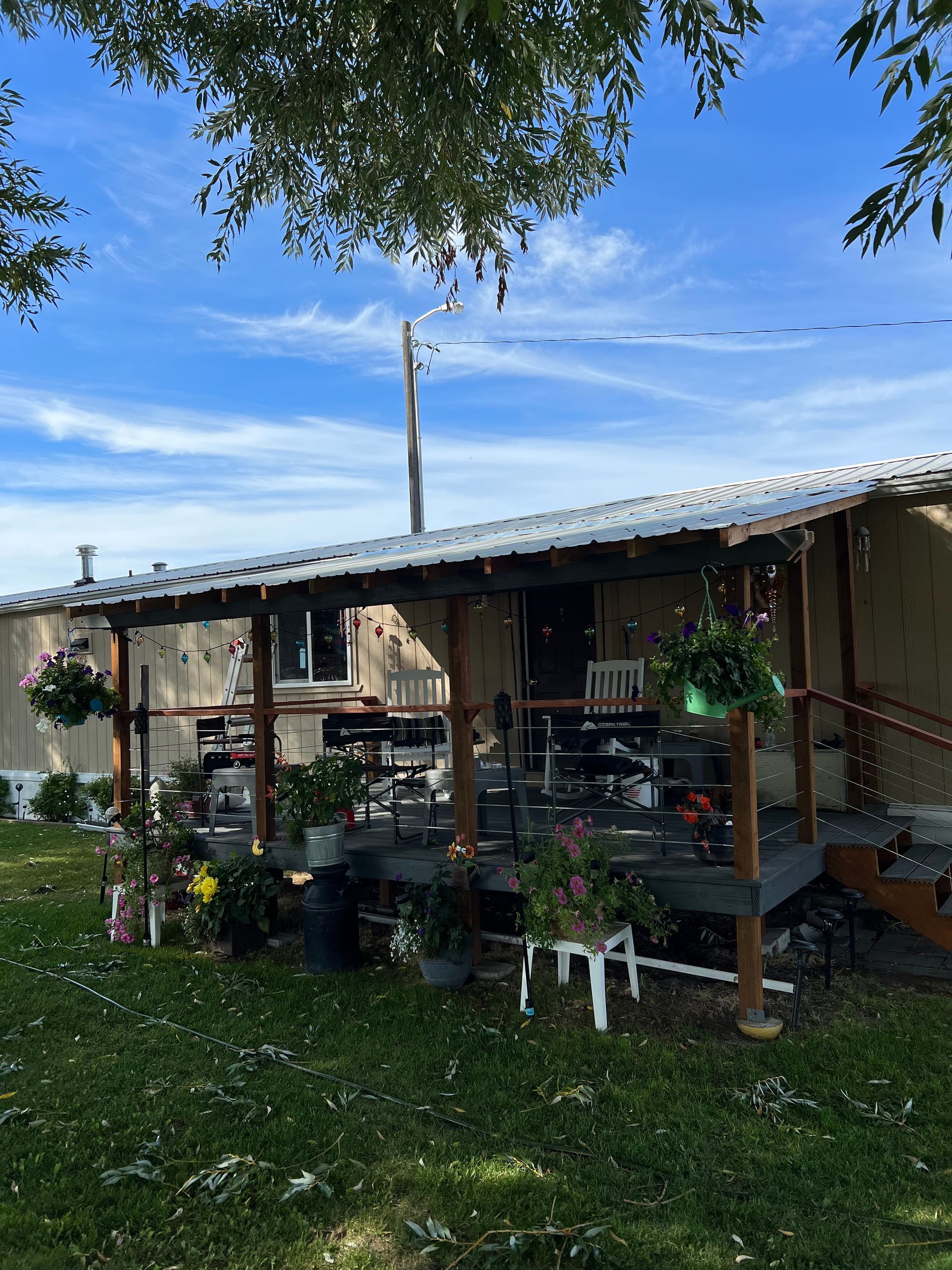 A house with a porch and flowers on it