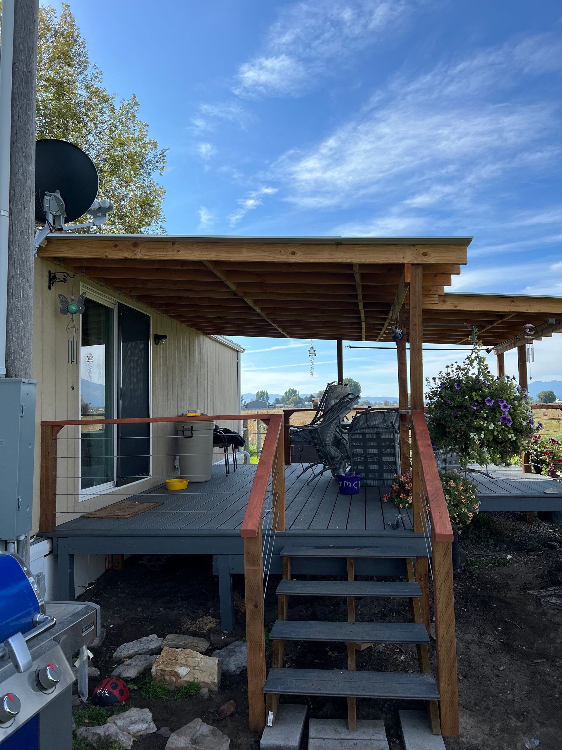 A large deck with stairs leading up to it