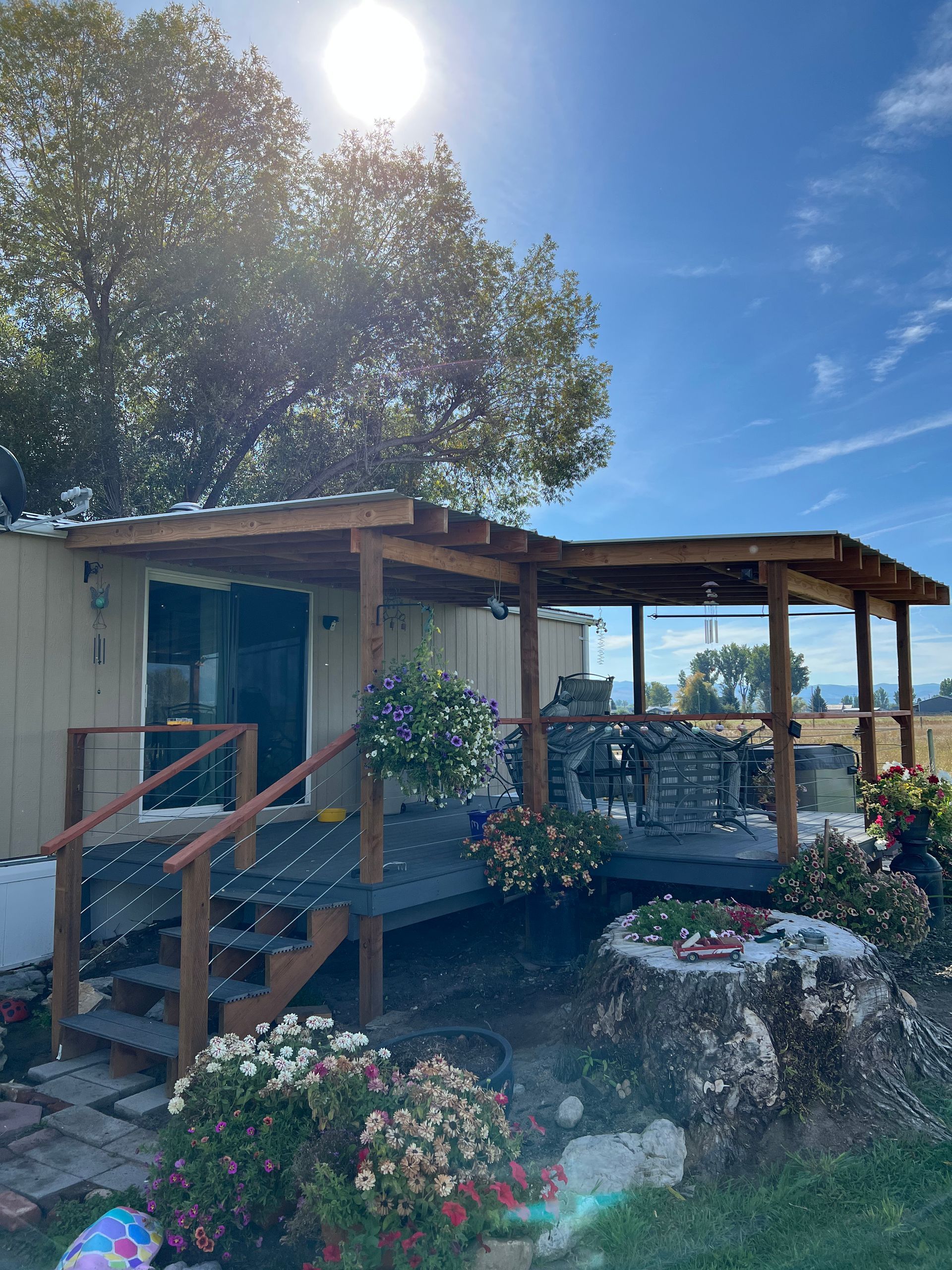 A house with a porch and stairs in front of it
