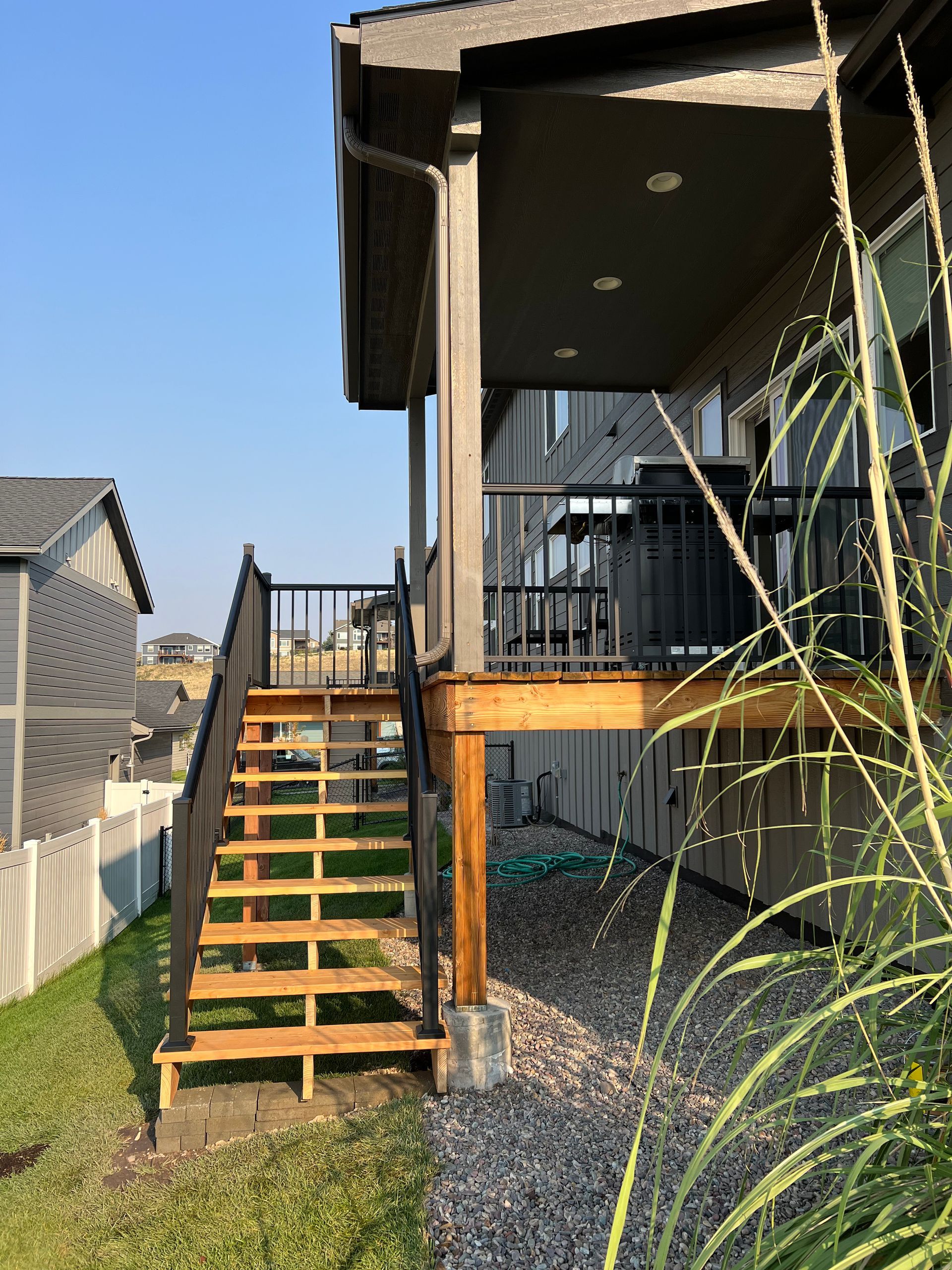 A wooden deck with stairs leading up to it