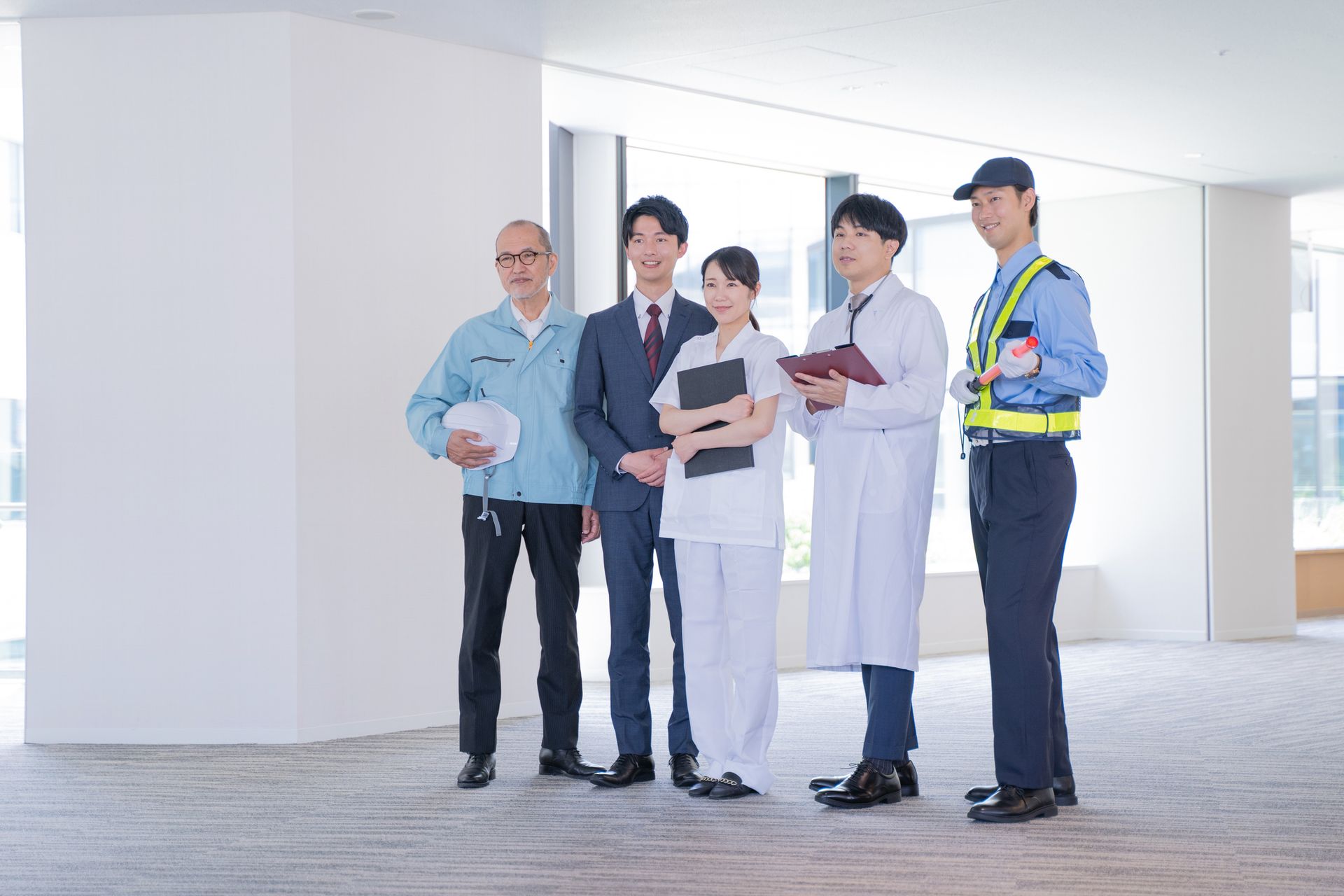 Group of professionals from different industries standing together representing a temp agency. Group of professionals from different industries standing together representing a temp agency.