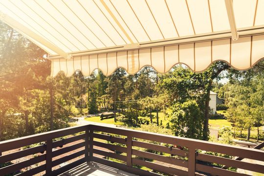 a veranda with awning