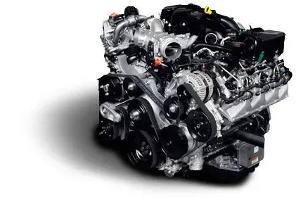 A complex engine assembly with belts, pulleys, and various components against a white background.