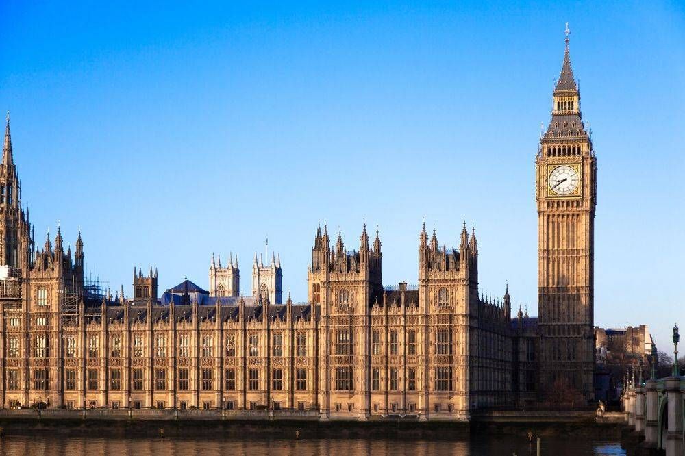 A large building with a clock on top of it.
