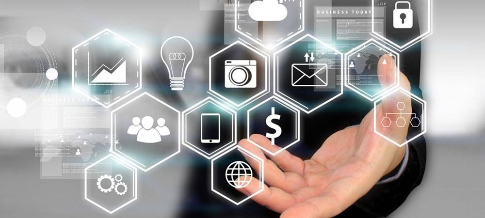 A man is using a virtual screen with icons on it.