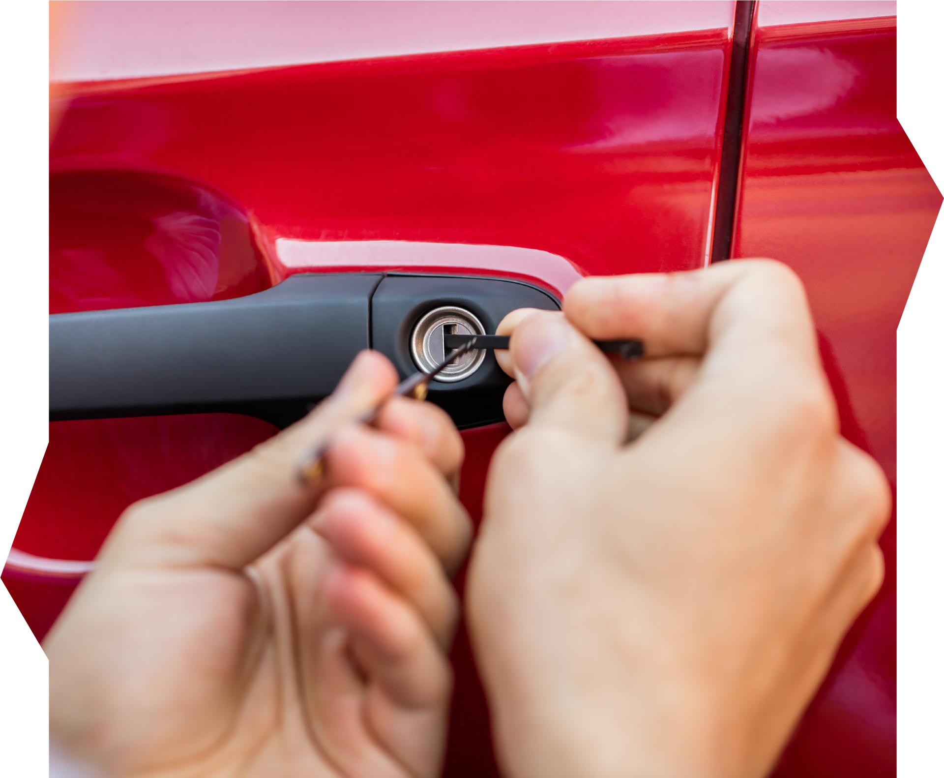 A person is opening a car door with a key.